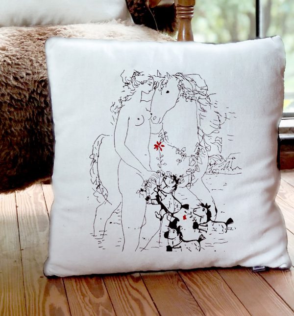 cavalier White cushion made of 100% cotton, with a simple design of a woman with a horse, decorates the interior of a house.