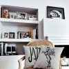 dear deer beige cushion made of 100% cotton, with a wonderful print winged deer design with a crown, decorates a fabric armchair in a modern house.
