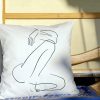 fabula white cushion made of 100% cotton, with printed female body design, close-up.