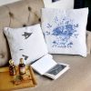 femme fatale white cushion made of 100% cotton, with print of female mouth and lips on a beige sofa.
