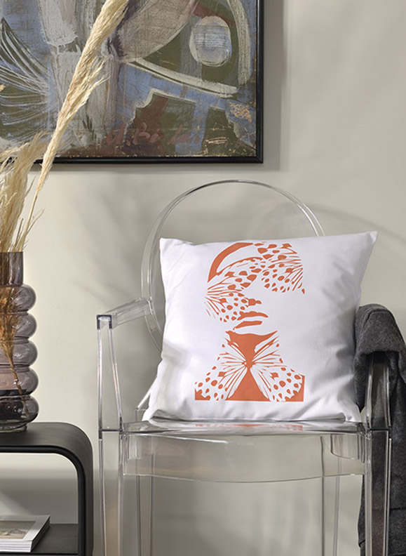 Madame butterfly Linen white garden cushion 46x46 with female face design with butterflies on a transparent chair inside house.