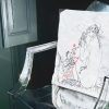 narcissa White cushion made of 100% cotton, design of a naked woman with a mirror on a transparent plexiglass chair.