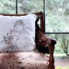 narcissa White cushion made of 100% cotton, design of a naked woman with a mirror on a leather armchair.