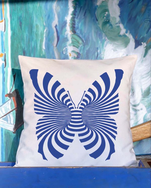 mariposa Λευκό μαξιλάρι από 100% βαμβάκι, με ιδιαίτερο σχέδιο μπλε πεταλούδας διακοσμεί εσωτερικό χώρο σπιτιού, μπροστά από πίνακα