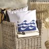 nautico Linen white garden cushion 46x46 with blue waves on bamboo armchair in summer house