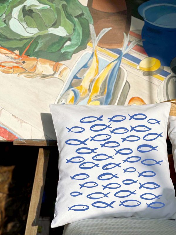 pisces Linen white cushion 46x46 with blue fish print on the interior of the house.